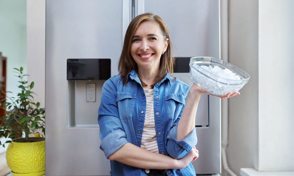 woman with bowl with ice cubes for cooling food